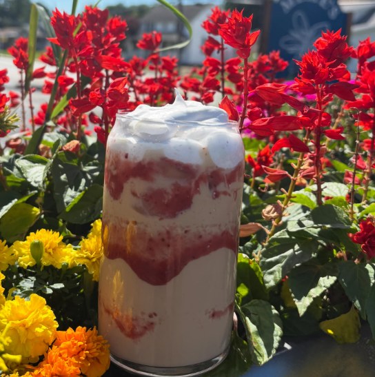 Strawberry Shortcake specialty drink in front of flowers